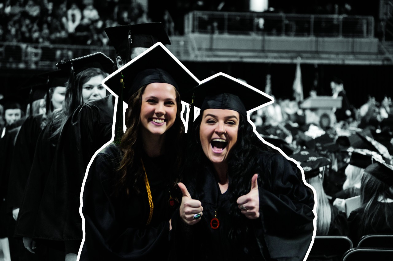 Students smiling at commencement