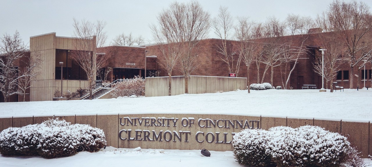 Snow falls on the University of Cincinnati Clermont College welcome sign